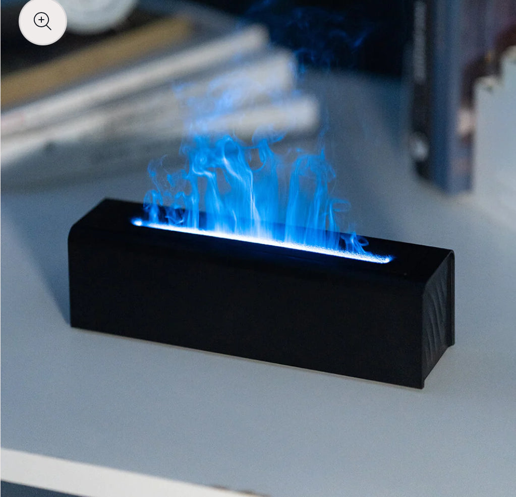 Aromatherapy diffuser with realistic flame and steam