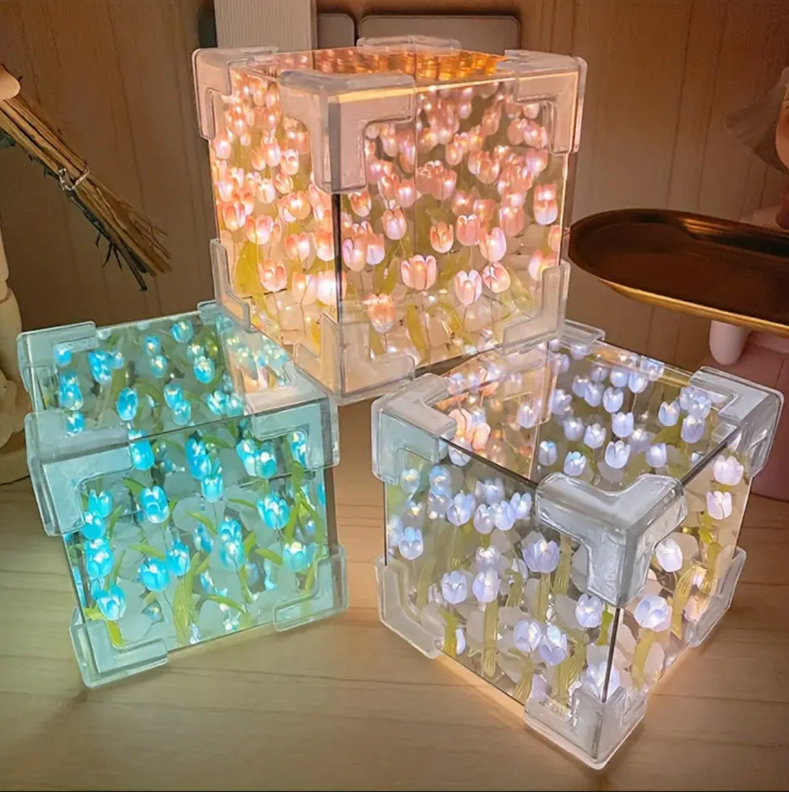 Warm light tulip night lamp next to mirror and decor